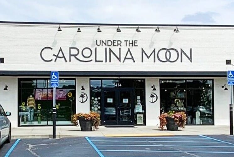 White store building with sign 