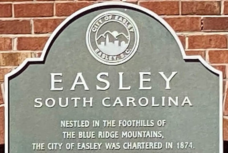 Sign for the town of Easley, South Carolina depicting logo and text with date of establishment.